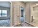Hallway connecting bedroom and bathroom with neutral walls and plush carpet at 335 Melody Ne Ln, Cartersville, GA 30121