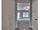 Bright hallway with neutral tones, leading into a carpeted room with backyard views, creating an inviting living space at 335 Melody Ne Ln, Cartersville, GA 30121