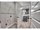 Laundry room with a view into the kitchen featuring gray cabinets and granite countertops at 335 Melody Ne Ln, Cartersville, GA 30121