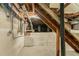 Unfinished basement featuring exposed beam ceilings, concrete flooring, and utility access at 4078 Bouldercrest Rd, Ellenwood, GA 30294