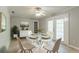 Bright dining area with a glass table, seating for four, and access to outdoor space through French doors at 4078 Bouldercrest Rd, Ellenwood, GA 30294