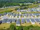 Aerial view of a residential neighborhood with green spaces and well-maintained homes at 4720 Dufour Dr, Lilburn, GA 30047