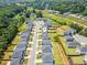Aerial view showcasing a home in a well-planned community with tree-lined streets and green spaces at 4720 Dufour Dr, Lilburn, GA 30047