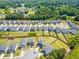 Aerial view highlighting a home situated in a residential neighborhood, surrounded by lush landscapes at 4720 Dufour Dr, Lilburn, GA 30047