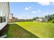 Expansive backyard with lush green grass and a sturdy wooden fence at 4720 Dufour Dr, Lilburn, GA 30047