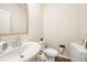 Modern half bathroom with a stylish vanity and fixtures at 4720 Dufour Dr, Lilburn, GA 30047