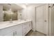 Modern bathroom with dual sinks, granite counters, and tiled shower at 4720 Dufour Dr, Lilburn, GA 30047