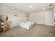 Minimal bedroom with white walls, carpet and a view to another room at 4720 Dufour Dr, Lilburn, GA 30047