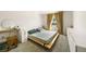 Bedroom features a platform bed, a window dressed with curtains, and closet at 4720 Dufour Dr, Lilburn, GA 30047