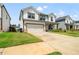 Charming home boasts a pristine lawn, two-car garage, and welcoming front porch at 4720 Dufour Dr, Lilburn, GA 30047