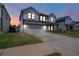 Charming home featuring a well-kept lawn, and inviting porch with an attached two-car garage at 4720 Dufour Dr, Lilburn, GA 30047