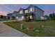 Charming home boasts a pristine lawn, and inviting porch with an attached two-car garage at 4720 Dufour Dr, Lilburn, GA 30047