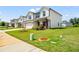 Charming home featuring a well-kept lawn, and inviting porch with an attached two-car garage at 4720 Dufour Dr, Lilburn, GA 30047