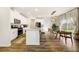 Well-lit kitchen with white cabinets, granite countertops, stainless steel appliances, and an adjacent dining area at 4720 Dufour Dr, Lilburn, GA 30047