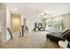 Upstairs living area with a comfortable couch and natural light from windows at 4720 Dufour Dr, Lilburn, GA 30047