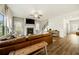Spacious living area showcasing a fireplace, modern furniture, and staircase with plenty of natural light at 4720 Dufour Dr, Lilburn, GA 30047