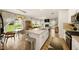 Open concept kitchen, dining and living spaces with stainless appliances and lots of light at 4720 Dufour Dr, Lilburn, GA 30047