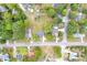 Aerial view of the home's lot and surrounding neighborhood showcasing mature trees and proximity to local roads at 2657 John Petree Rd, Powder Springs, GA 30127