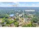 Aerial view of the home and surrounding neighborhood in Powder Springs with mature trees at 2657 John Petree Rd, Powder Springs, GA 30127