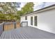 Exterior view from the back deck, featuring white siding, a railing, and double doors leading inside at 2657 John Petree Rd, Powder Springs, GA 30127
