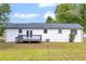 View of the house from the backyard showing the deck and nice lawn at 2657 John Petree Rd, Powder Springs, GA 30127