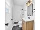 Modern bathroom with patterned floor and updated vanity at 2657 John Petree Rd, Powder Springs, GA 30127