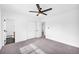 Bedroom featuring carpet, ceiling fan, en suite bath, and double door closet at 2657 John Petree Rd, Powder Springs, GA 30127