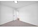 Bright bedroom featuring neutral carpet and fresh white paint at 2657 John Petree Rd, Powder Springs, GA 30127
