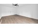 Spacious bedroom featuring modern vinyl flooring, a ceiling fan, and a closet at 2657 John Petree Rd, Powder Springs, GA 30127