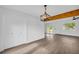 Open dining area featuring modern lighting, new flooring, and access to the backyard at 2657 John Petree Rd, Powder Springs, GA 30127