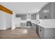 Modern kitchen features gray cabinets, stainless steel appliances, and hardwood floors at 2657 John Petree Rd, Powder Springs, GA 30127