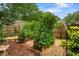 Lush backyard featuring a garden with raised beds and greenery growing on a trellised archway at 3349 Concord Se Cir, Smyrna, GA 30080