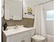 Classic bathroom featuring a white sink and vanity, wainscoting, and a shower with white subway tile at 3349 Concord Se Cir, Smyrna, GA 30080