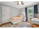 Bedroom with light grey walls, hardwood floors, ceiling fan, and a window providing natural light at 3349 Concord Se Cir, Smyrna, GA 30080