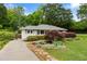 Quaint single-story home with mature trees, lush landscaping, and a charming entrance at 3349 Concord Se Cir, Smyrna, GA 30080