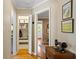 Hallway featuring storage closet, hardwood floors and views to other rooms at 3349 Concord Se Cir, Smyrna, GA 30080