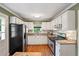 Bright kitchen features granite countertops, stainless steel appliances, and white cabinetry at 3349 Concord Se Cir, Smyrna, GA 30080