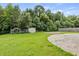 Backyard featuring grassy area, an outdoor storage shed, and a patio area at 3385 Amhurst Pkwy, Atlanta, GA 30349