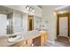 Double sink bathroom with separated areas and decorative mirrors at 3385 Amhurst Pkwy, Atlanta, GA 30349
