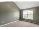 Bedroom with neutral paint and carpet, vaulted ceiling and window allowing natural light in at 3385 Amhurst Pkwy, Atlanta, GA 30349
