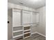 Walk-in closet complete with adjustable shelving and hanging rods at 3385 Amhurst Pkwy, Atlanta, GA 30349