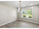 Bright dining room with wood floors and modern lighting, offering a cozy atmosphere at 3385 Amhurst Pkwy, Atlanta, GA 30349