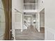 Welcoming foyer with wood-look floors, a staircase, and soaring ceilings at 3385 Amhurst Pkwy, Atlanta, GA 30349