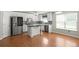 Modern kitchen with stainless steel appliances, island, and bright white cabinets at 3385 Amhurst Pkwy, Atlanta, GA 30349