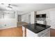 Charming kitchen with a breakfast bar, kitchen island and a seamless transition to the dining area at 3385 Amhurst Pkwy, Atlanta, GA 30349