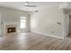 Cozy living room featuring a fireplace, neutral paint colors, and hardwood flooring at 3385 Amhurst Pkwy, Atlanta, GA 30349