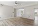 Spacious living room featuring a ceiling fan and recently upgraded hardwood flooring at 3385 Amhurst Pkwy, Atlanta, GA 30349