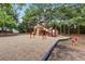 Community playground featuring various slides, climbing structures and benches, on a mulch surface at 3385 Amhurst Pkwy, Atlanta, GA 30349