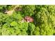 A birds eye view of a wooded home location that is surrounded by green vegetation at 12728 Bells Ferry Rd, Canton, GA 30114