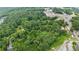 Breathtaking aerial view of the property nestled among mature trees, showcasing its privacy and serene setting at 12728 Bells Ferry Rd, Canton, GA 30114